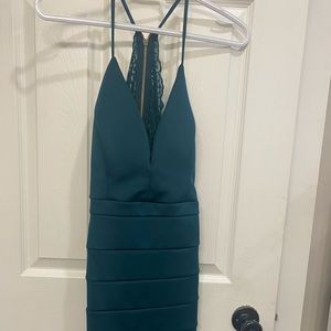 Emerald backless dress.